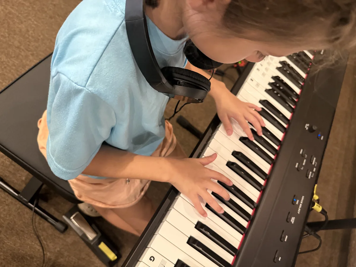 Student practicing at a keyboard