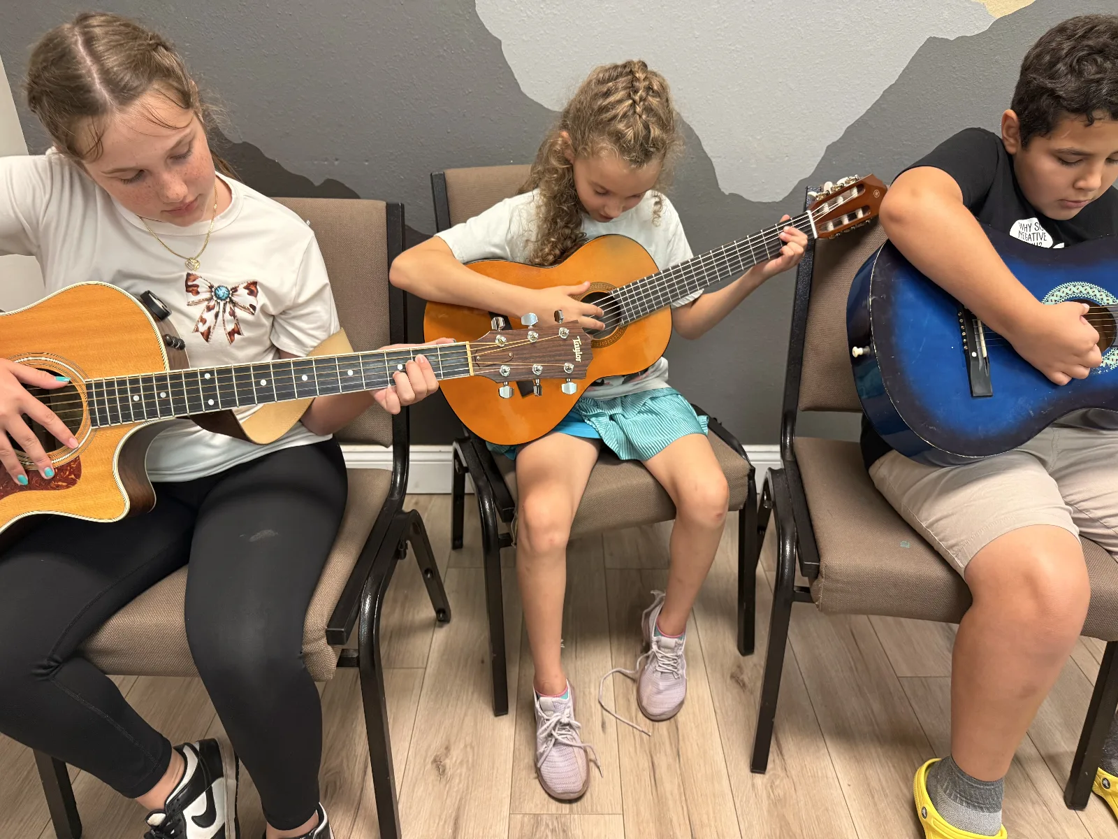 Student playing guitar
